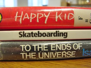 spines of 3 books creating a poem