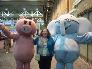 Katie Salo posing with people dressed in costumes of book characters