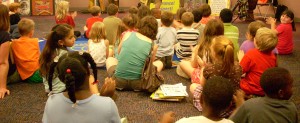 group of children listening to a presentation