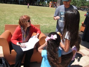 Pat Mora reading at Houston celebration.
