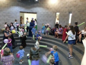 children at play with pool noddle light sabers