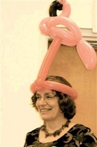 Terri Sherman wearing a flamingo balloon hat
