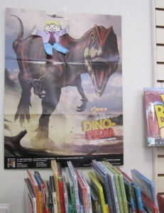 Flat Stanley and on a dinosaur poster