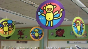 read with a monkey on paper decor hanging from the ceiling