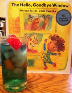 book cover of The Hello, Goodbye Window by Norton Juster next to a cocktail