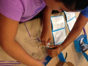 two kids building a Spinbot