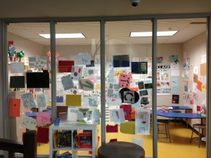 arts and crafts posted on the walls of a room