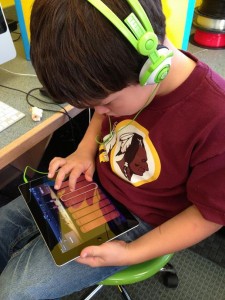 child playing on an i-Pad