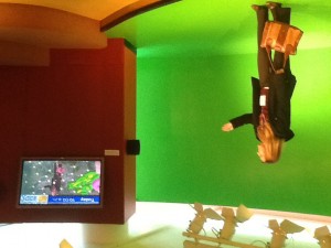 woman in front of a green screen