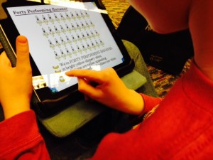child playing on an i-Pad