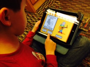 child playing on an i-Pad