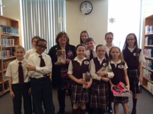 group of children and adult at library