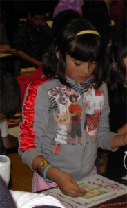 girl creating a collage