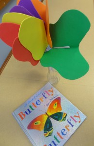 book Butterfly Butterfly sitting on a table with foam butterflies in a jar