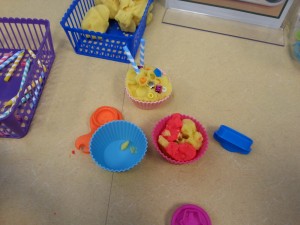 play doe and candles in cupcake holders