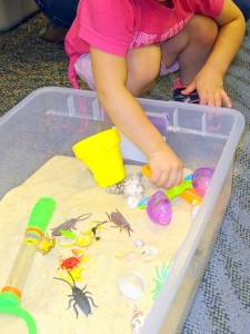 child playing in a sand box