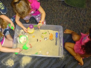 children playing with a sand box