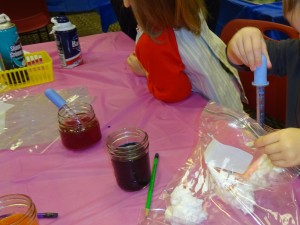 children experimenting with food color and shaving cream
