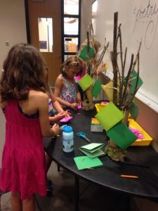 children writing poems for the poetry tree