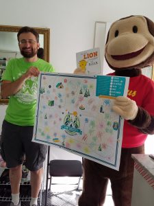 posing with Curious George