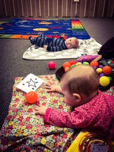Photo of babies on floor