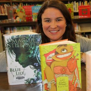 Photo of librarian with books