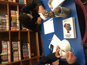 Students working on their masks