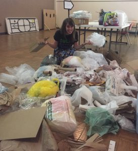 Blogger surrounded by Egg Drop Challenge materials