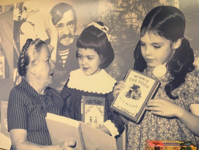 A mural of Dr. Lena de Grummond with two young friends greets visitors at the entrance to the de Grummond
