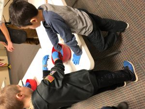Kids are taught to make pot stickers in the Kids' Kitchen