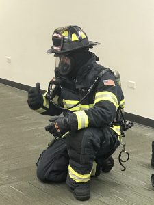 A firefighter who visited the library as part of Homeschool at the Library