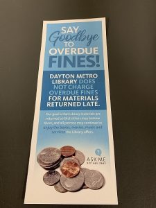 Bookmark at Dayton Metro Libraries explaining the no late fees policy.