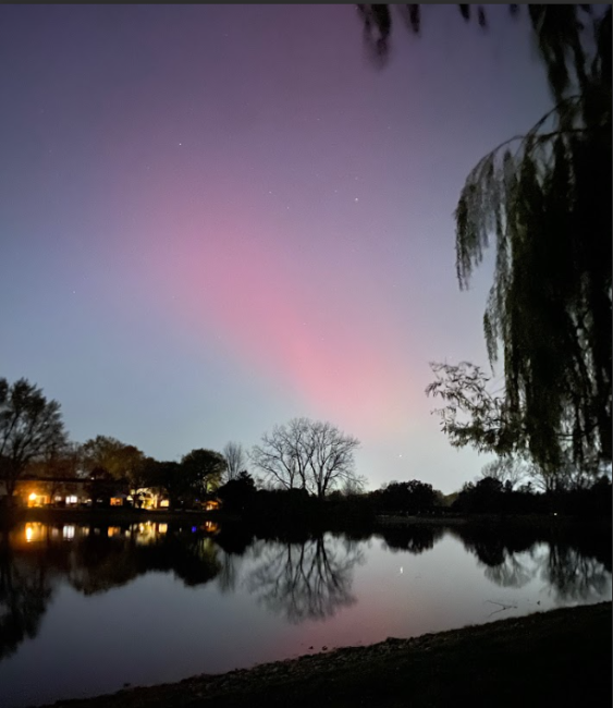 Northern Lights over lake with reflection