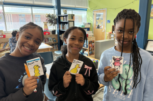 3 Girls Holding Up Animal Zines